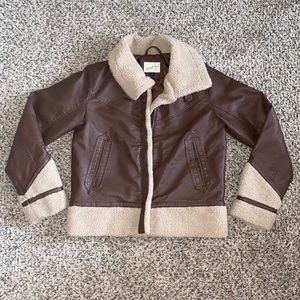 Faux leather waist length coat with shearling trimming